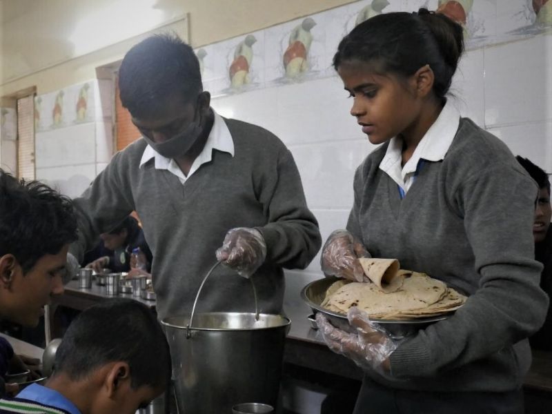 Helping during meal times at a school for the blind in Delhi